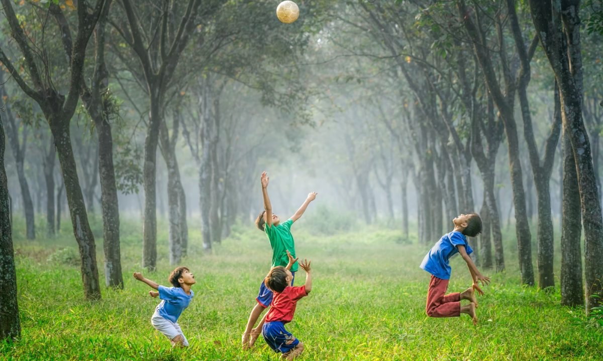 Children playing in a sunlit park